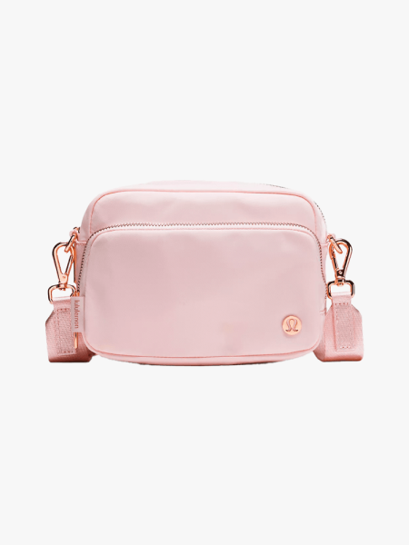 Lululemon Everywhere Crossbody Bag in branded component on a light gray background